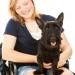 Woman in wheelchair with dog
